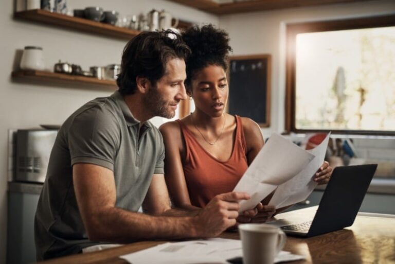Couple Looking At AC Bills Together